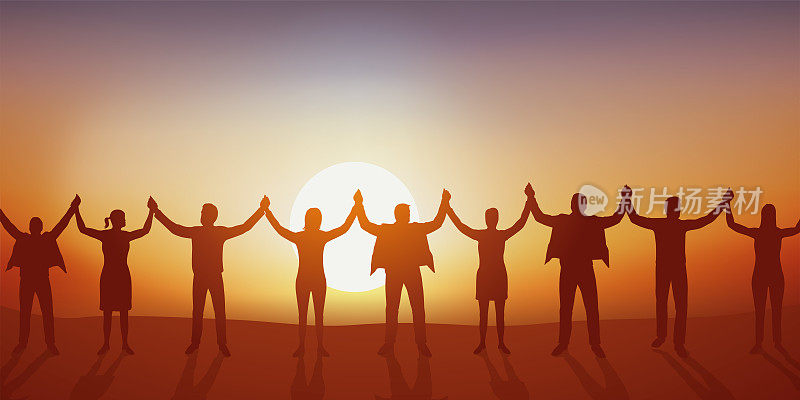 A group forms a human chain by reaching out to each other.